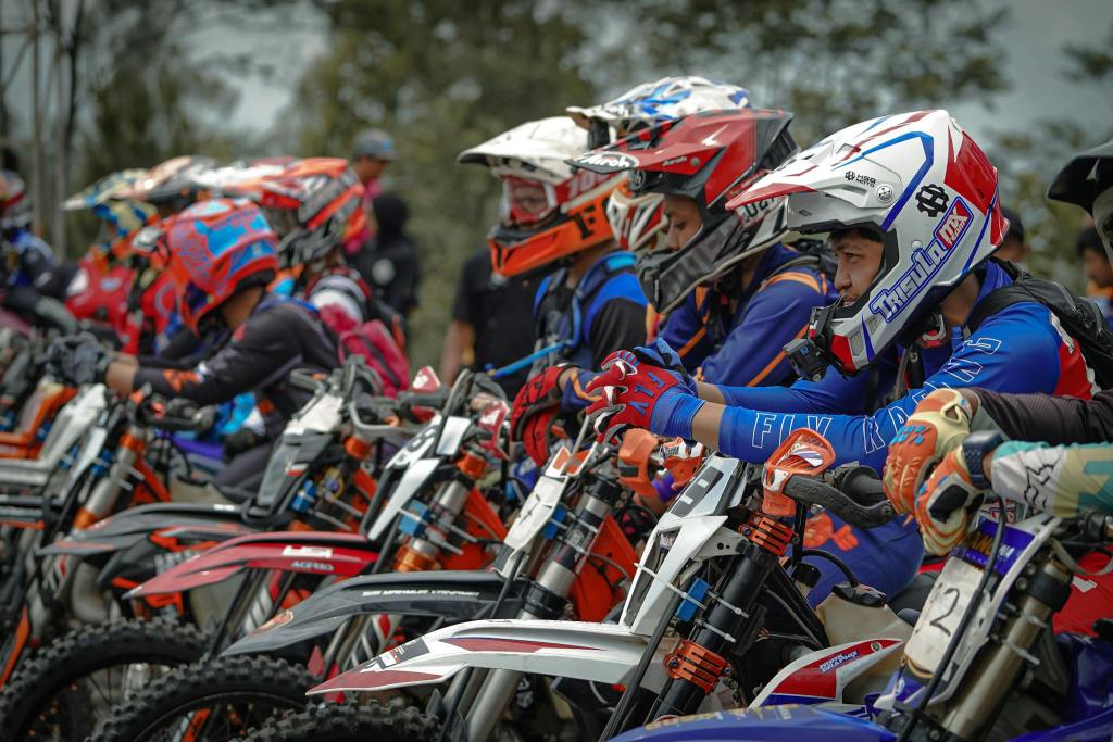 Group of enduro racers with dirt bikes, ready for motocross race in Yogyakarta, Indonesia.